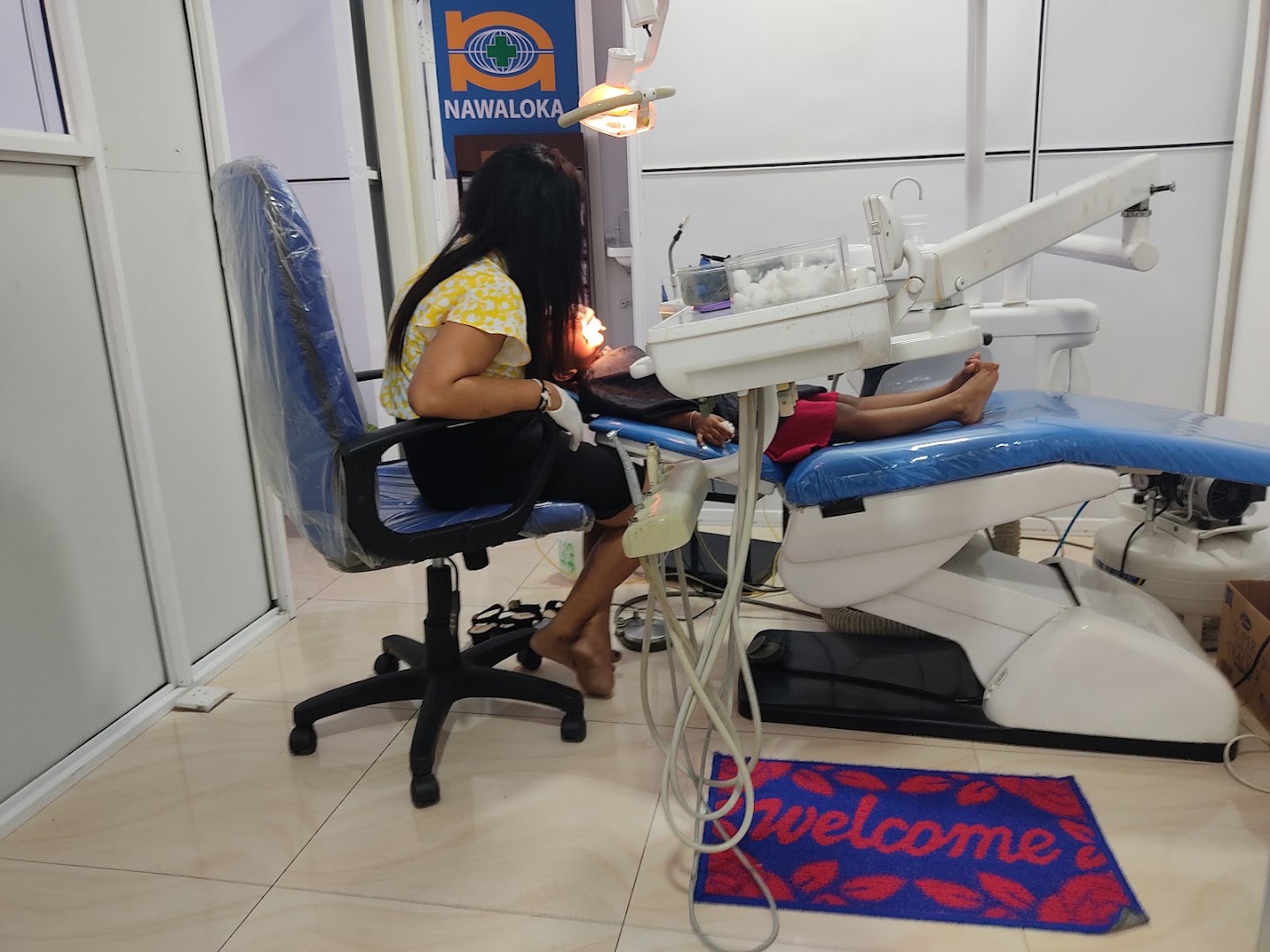 Dental procedure taking place in a treatment room