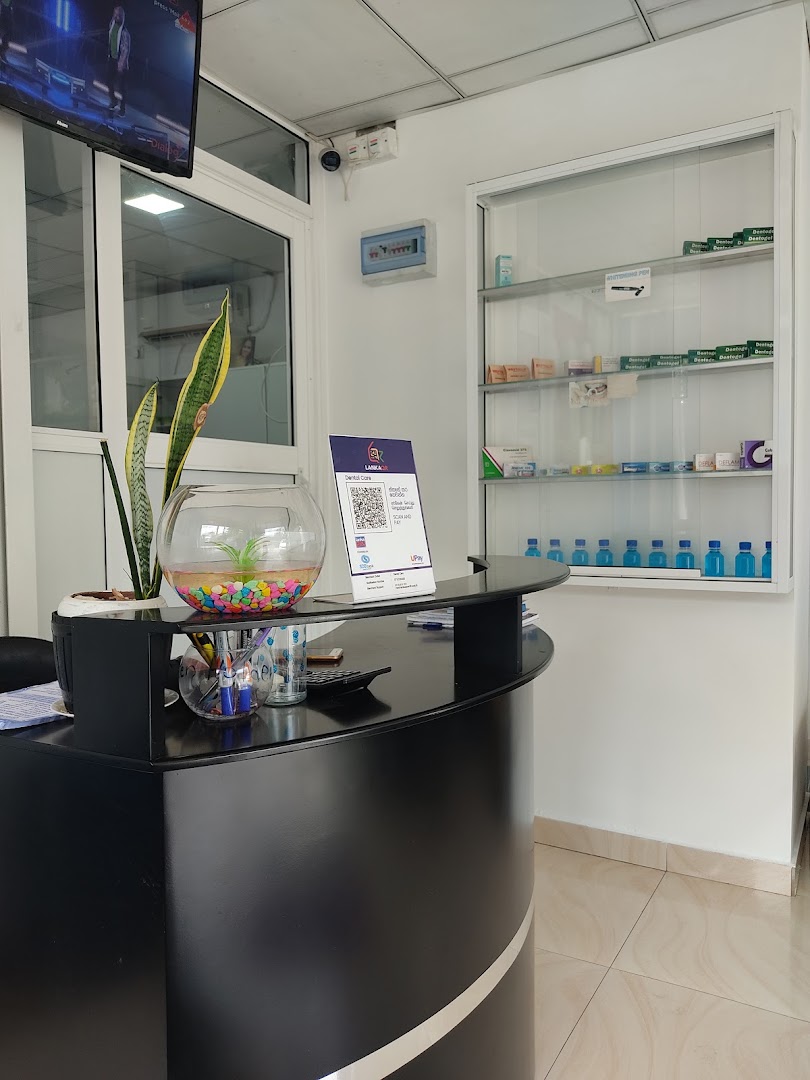 Curved black reception counter and glass display cabinet